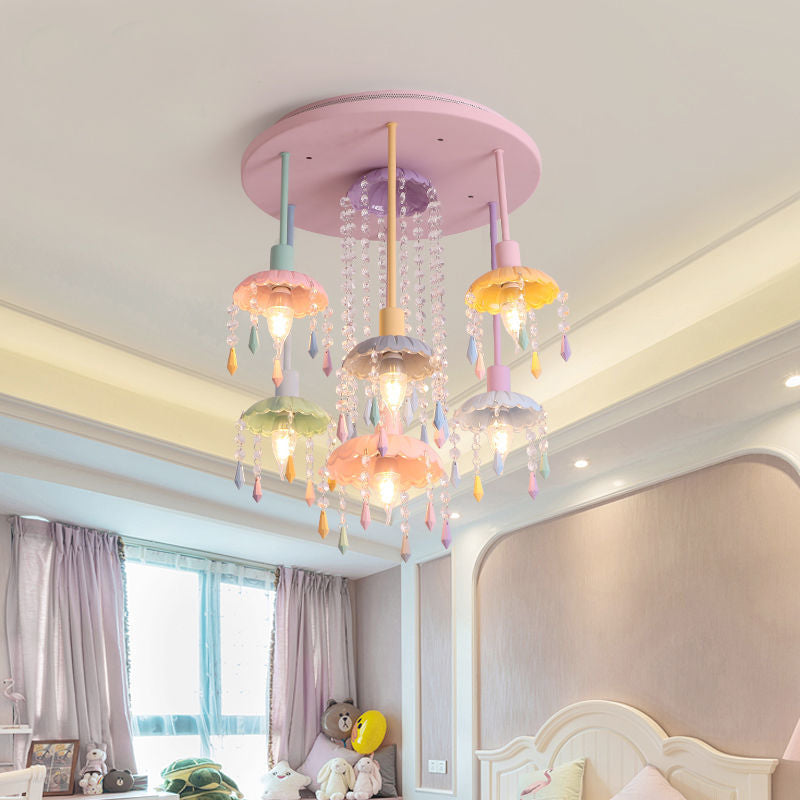 Close-up view of the pink Macaron chandelier showcasing its crystal details.