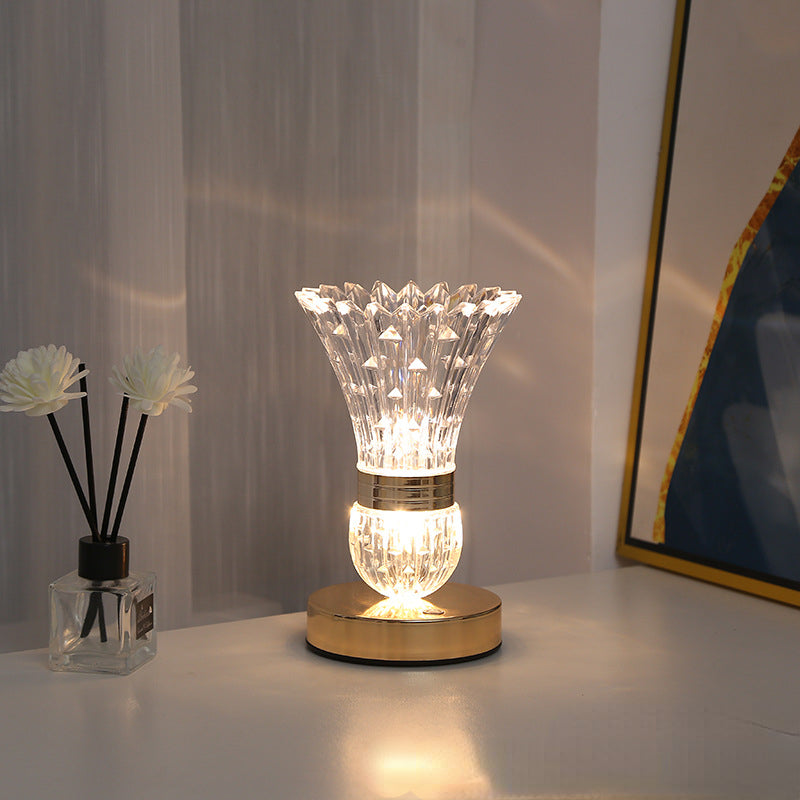The modern decorative lamp illuminated in a cozy living room setting.