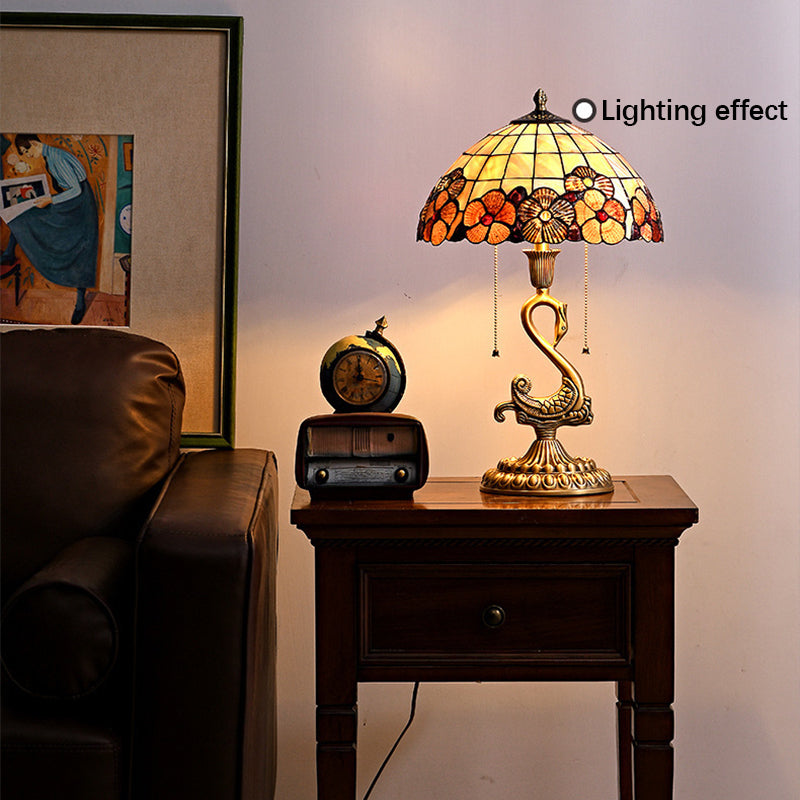 Elegant Swan Brass Table Lamp showcasing its unique design and copper base from a side angle.
