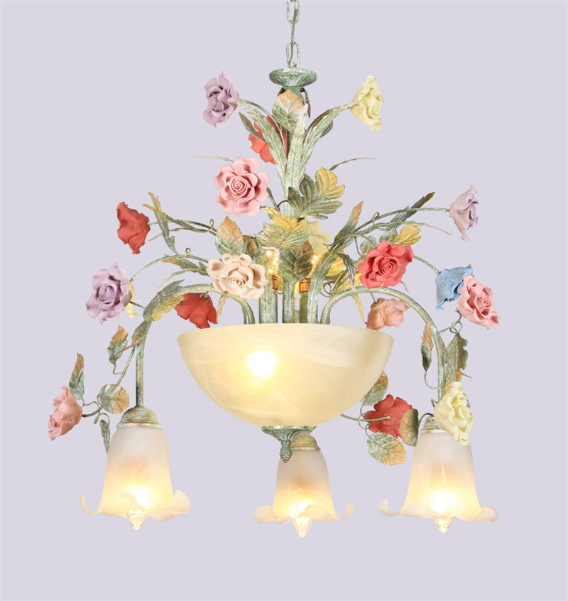 Close-up of the LED chandeliers frosted glass shade, illuminating a living room.