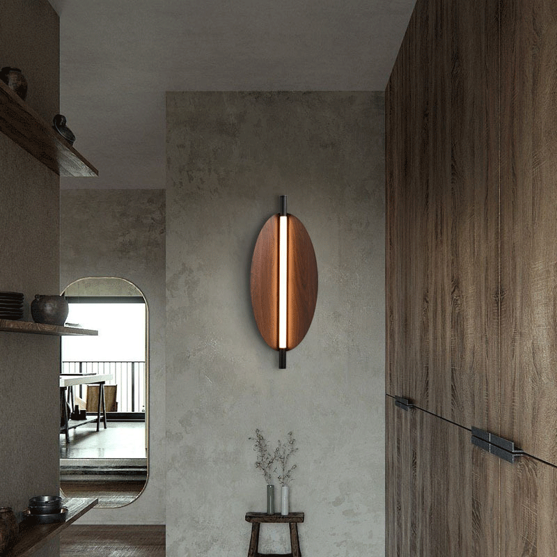 Scandinavian Wood Grain Wall Lamp installed in a cozy living room, illuminating the space beautifully.