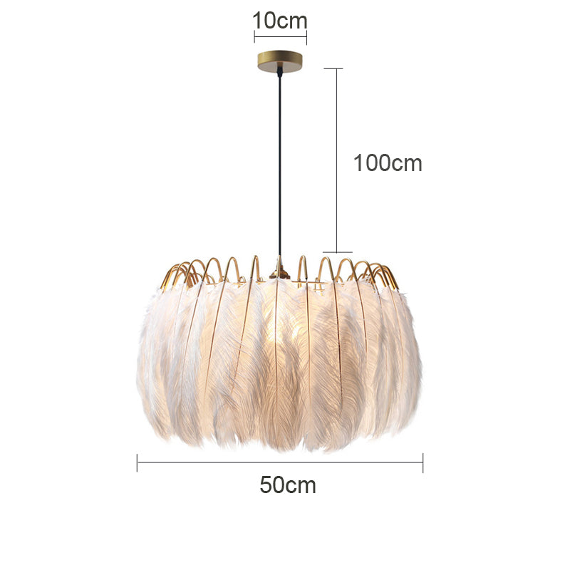 The elegant ostrich feather LED pendant light hanging in a modern dining room.