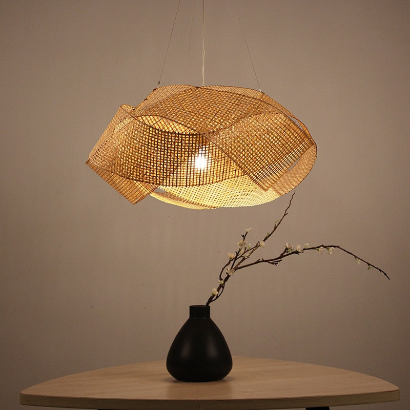 Bamboo rattan pendant light showcasing its intricate design and warm glow in a cozy living room.