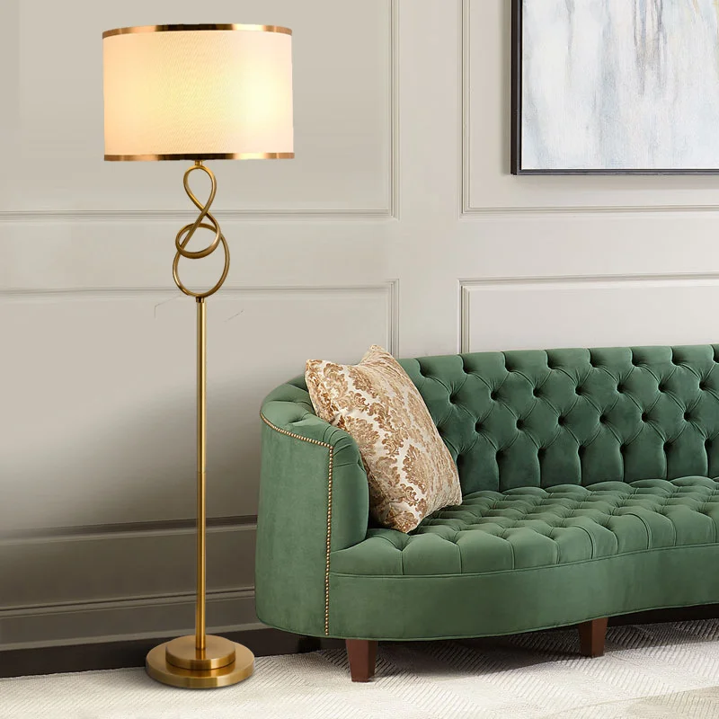 Elegant Gold LED Floor Lamp showcasing its spiral design and fabric shade in a cozy living room setting.