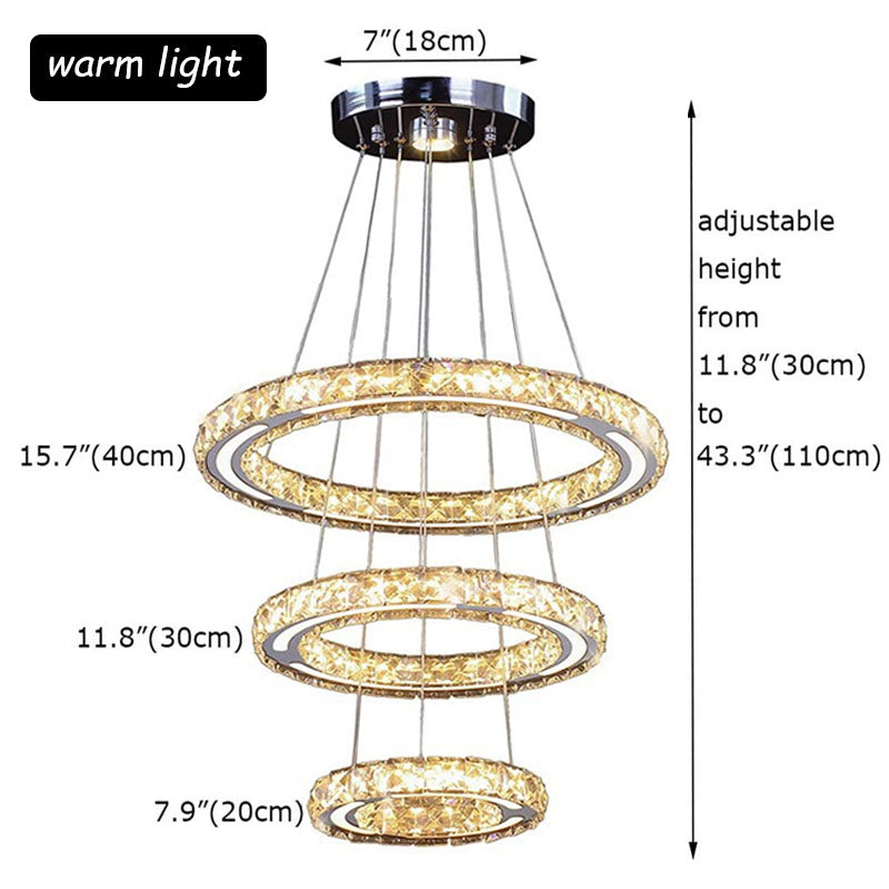 Elegant 3-ring crystal LED pendant light in a contemporary dining room setting.