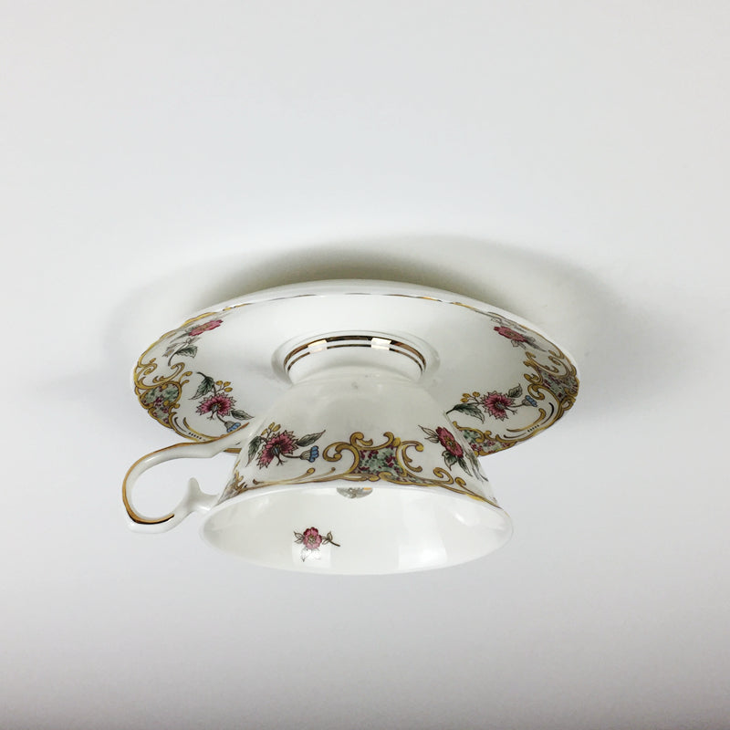 Installation of the modern light fixture in a dining room, highlighting its decorative impact and functionality.