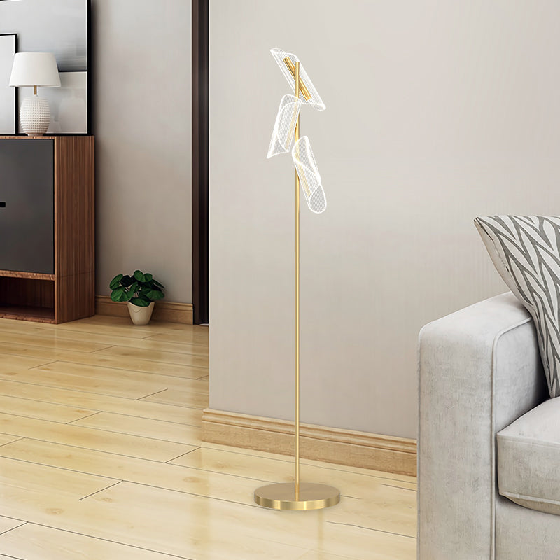 Stylish floor lamp with acrylic shade illuminating a modern living room.