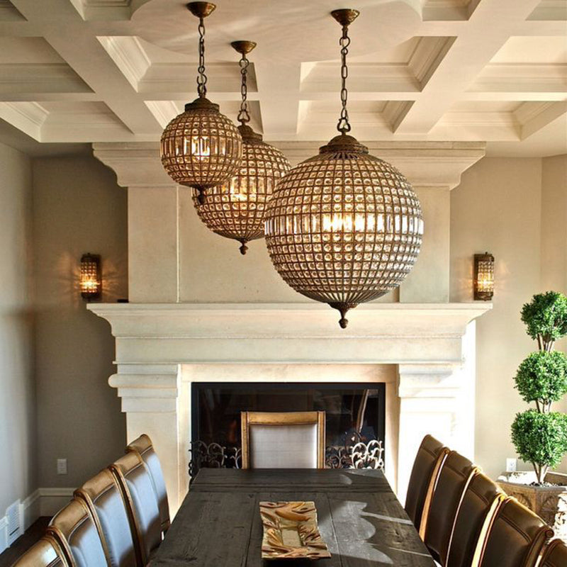 Elegant LED crystal pendant lamp in a cozy living room setting.