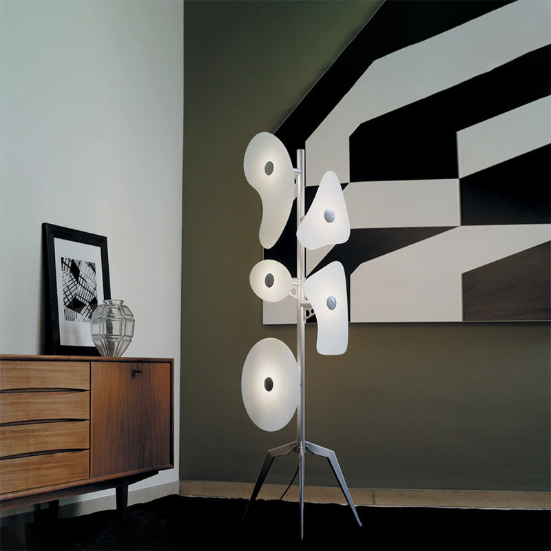 Elegant Orbital Art Deco Floor Lamp showcasing colorful glass reflectors in a modern living room setting.