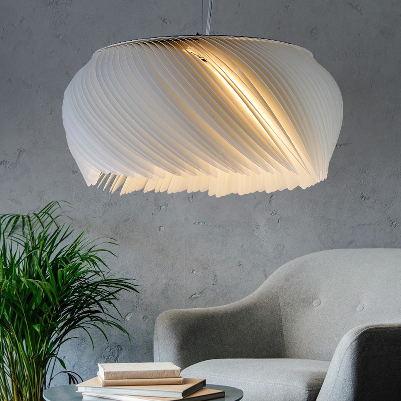 Stylish acrylic lamp hanging in a cozy living room setting.