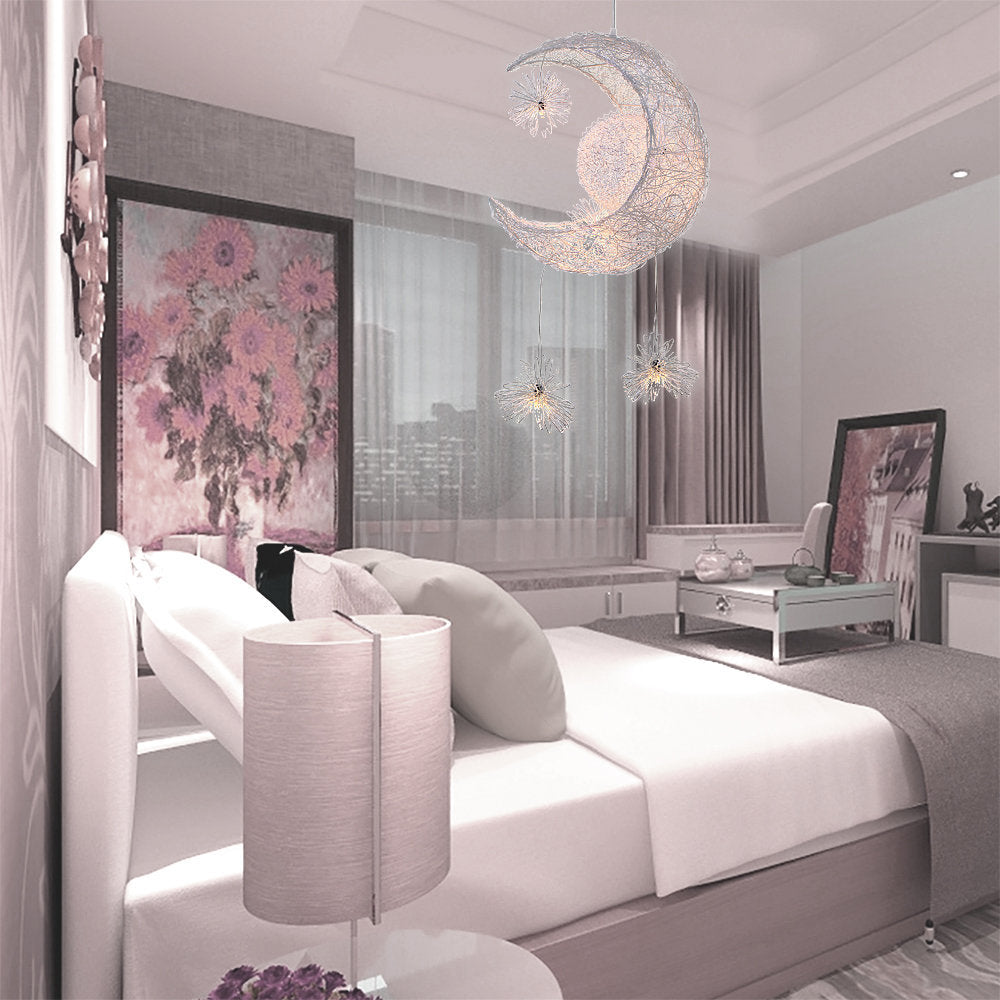 Starlight Crescent Moon LED Pendant Lamp illuminating a cozy bedroom setting.