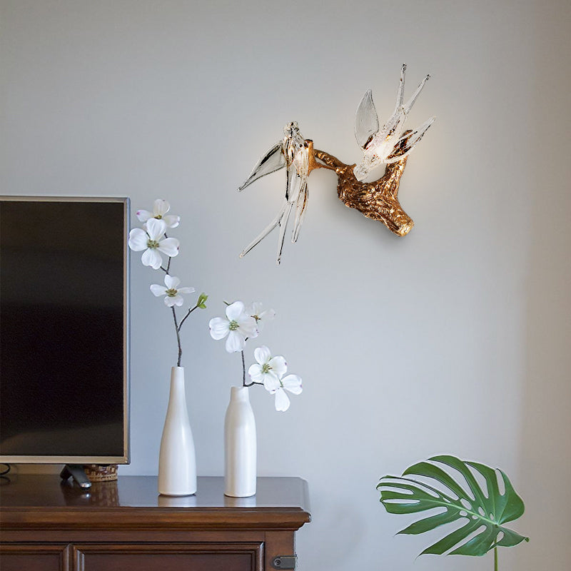 Side view of the copper wall sconce illuminating a stylish bedroom.