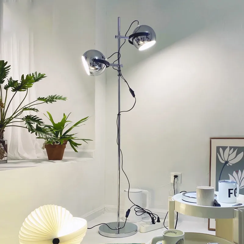 Side view of the Modern Chrome Bauhaus LED Floor Lamp in a cozy living room setting.