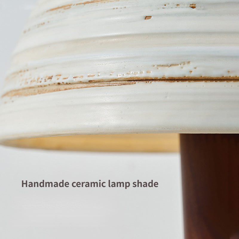 Close-up of the ceramic lampshade of the best modern wooden table lamp, highlighting its craftsmanship.