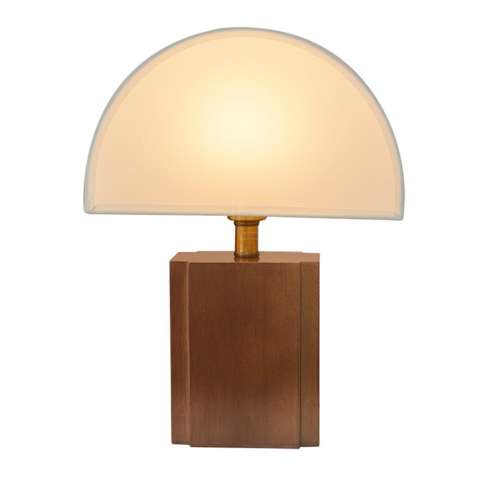 The Retro Solid Wood Decorative Table Lamp illuminating a cozy bedroom setting.