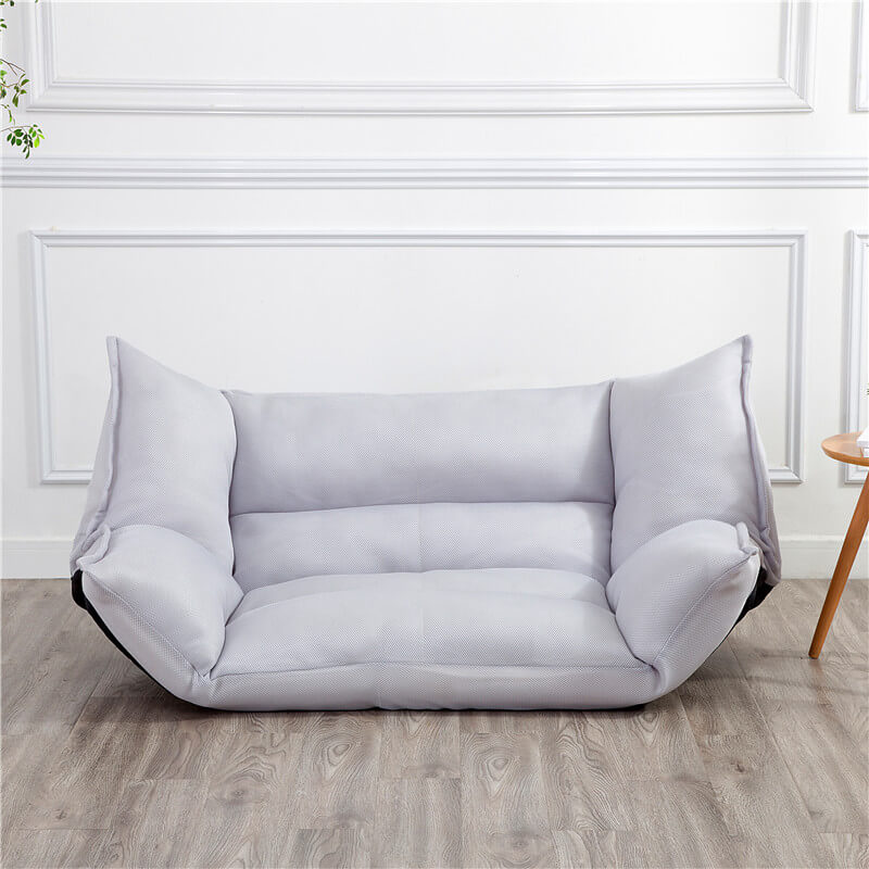 The sofa bed in use as a cozy bed, showcasing its functionality in a compact living area.