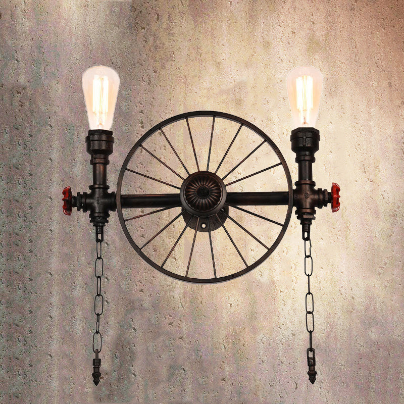 Vintage industrial iron wall lamp with a wheel design, perfect for dining room lighting.