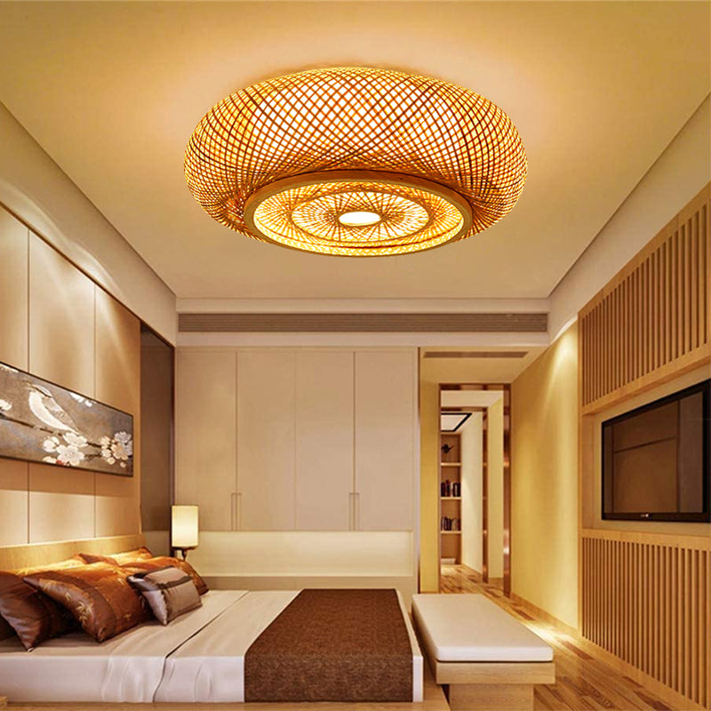 Bamboo ceiling light casting a warm glow in a modern bedroom.