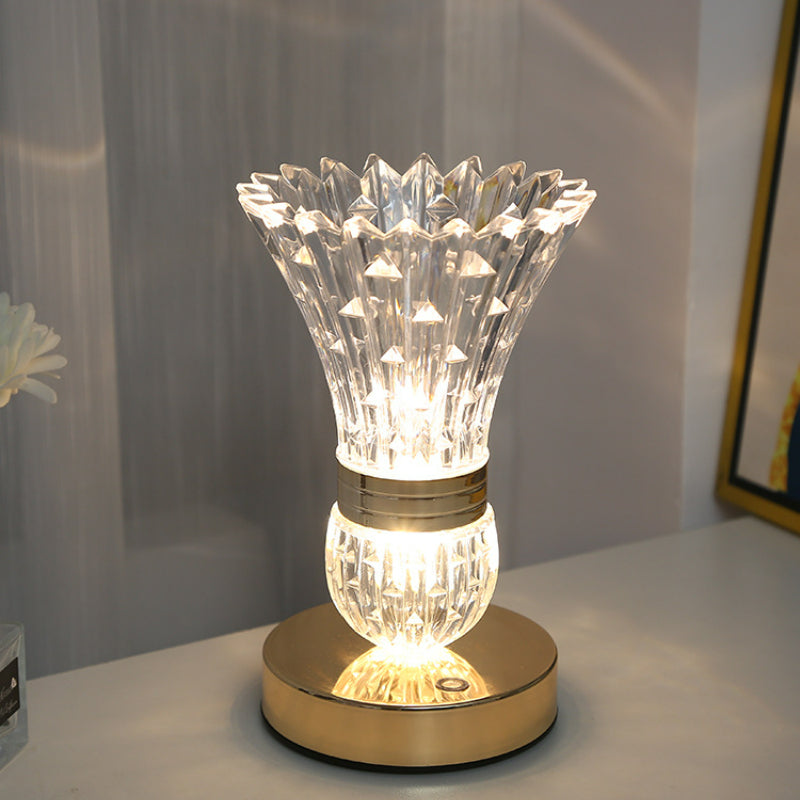 Close-up view of the touch control feature on the decorative lamp.