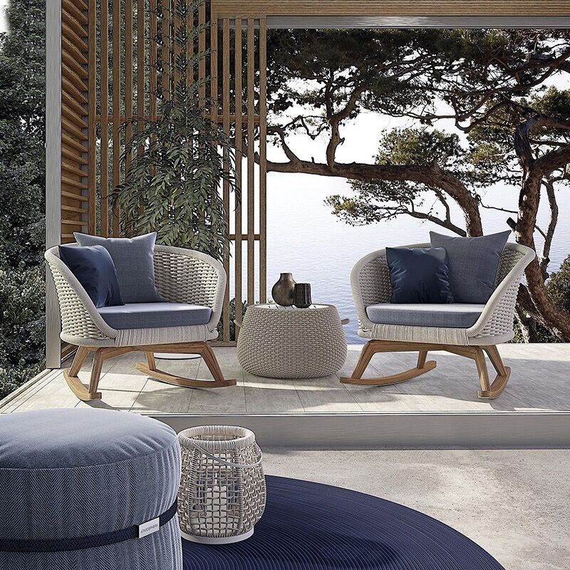 Side view of the Elegance Rattan and Teakwood set, showcasing the teakwood finish and weather-resistant materials.
