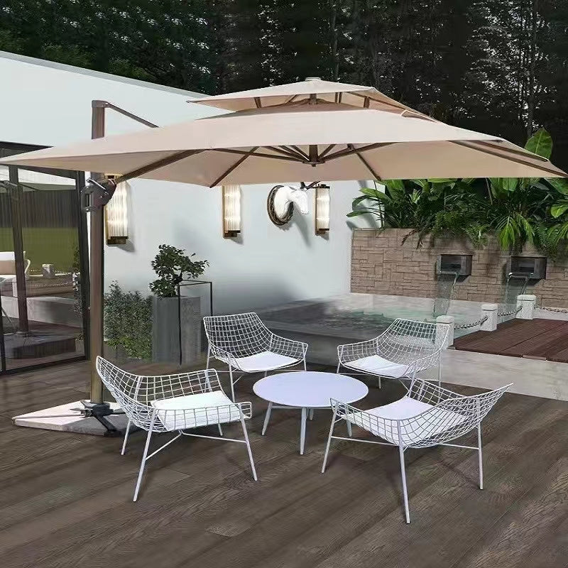 Modern outdoor armchair featuring a removable washable cushion in a vibrant garden setting.