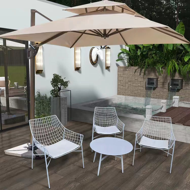 Sleek stainless steel outdoor armchair with gray cushion, ideal for garden relaxation.