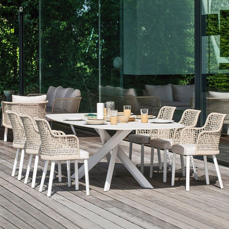 Weather resistant patio dining furniture featuring stainless steel accents
