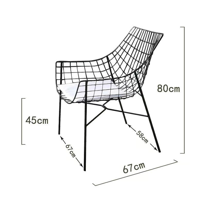 Modern outdoor armchair featuring a removable washable cushion in a vibrant garden setting.