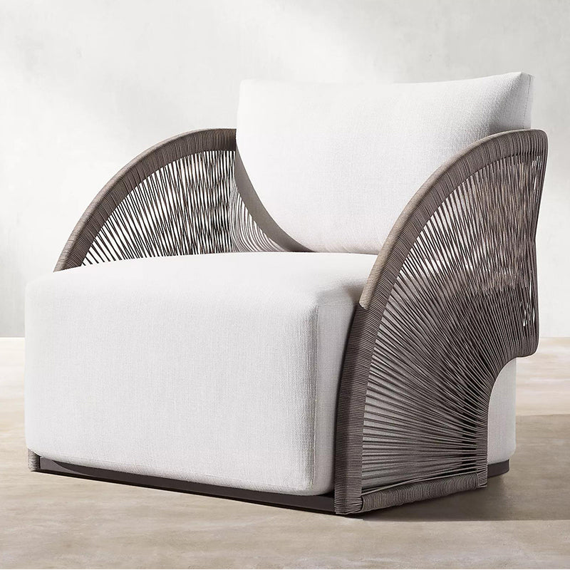 Close-up of the weather-resistant fabric on the rattan outdoor sofa, highlighting quality and durability.