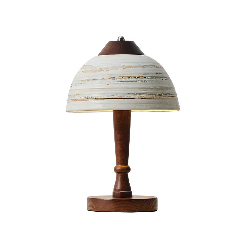 Stylish table lamp for reading, illuminating a modern workspace with soft light.
