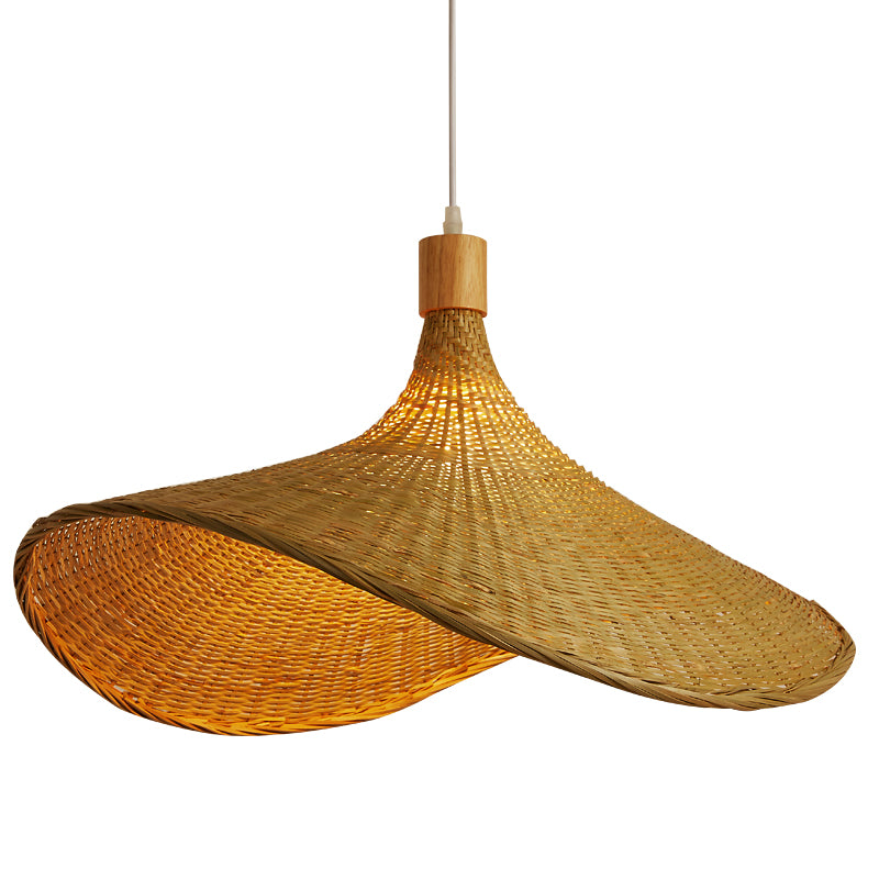 Bamboo pendant light hanging over a dining table, creating an inviting atmosphere.