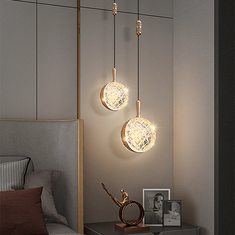Luxury gold ceiling light for hotel room installed over plush bedding setup