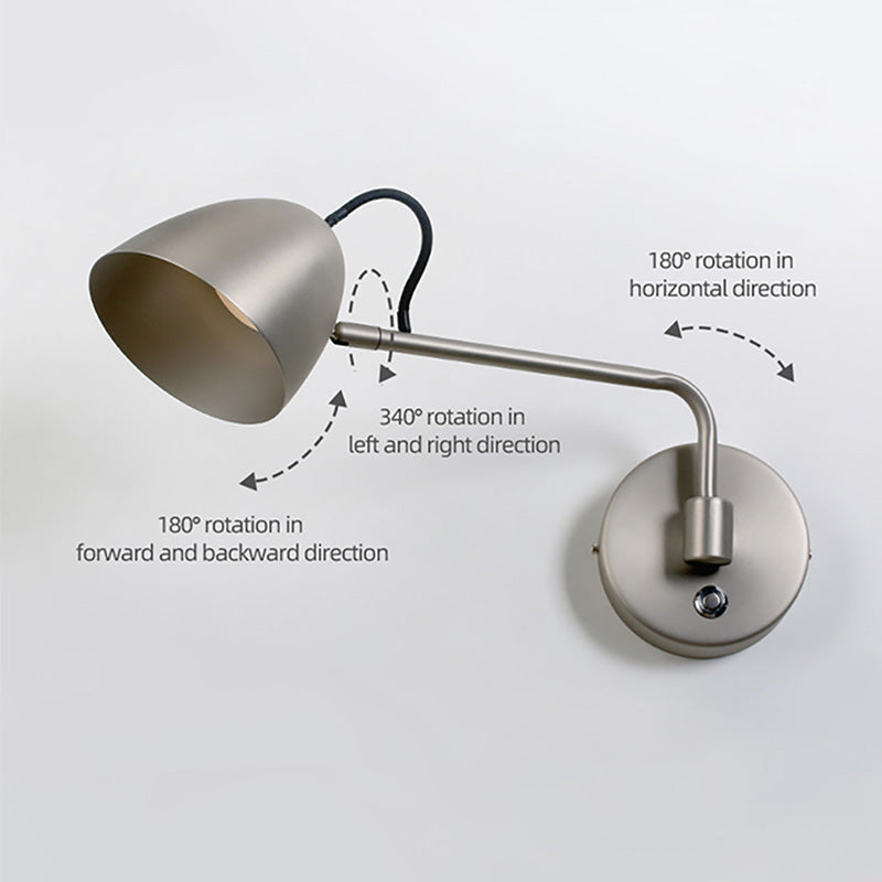 Nickel rocker LED wall light installed above a bedroom headboard — ideal affordable wall light for bedroom.
