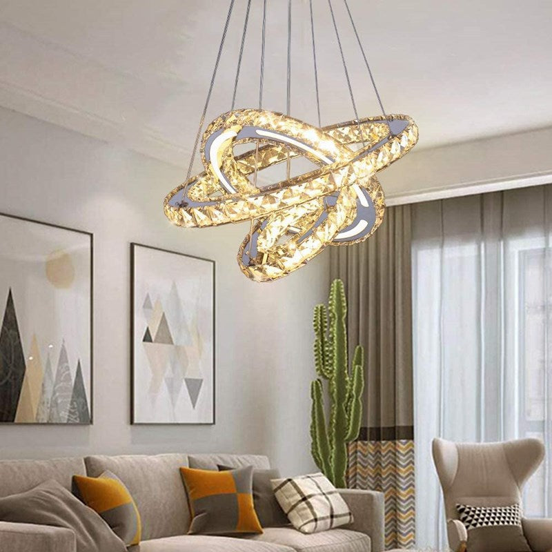 Installation of the adjustable crystal pendant light in a high-ceiling living area.