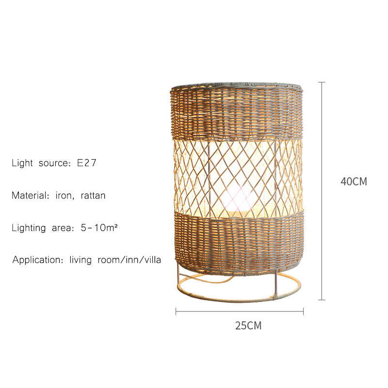The rattan floor lamp lit up in a cozy living room, emphasizing its warm ambiance and stylish look.