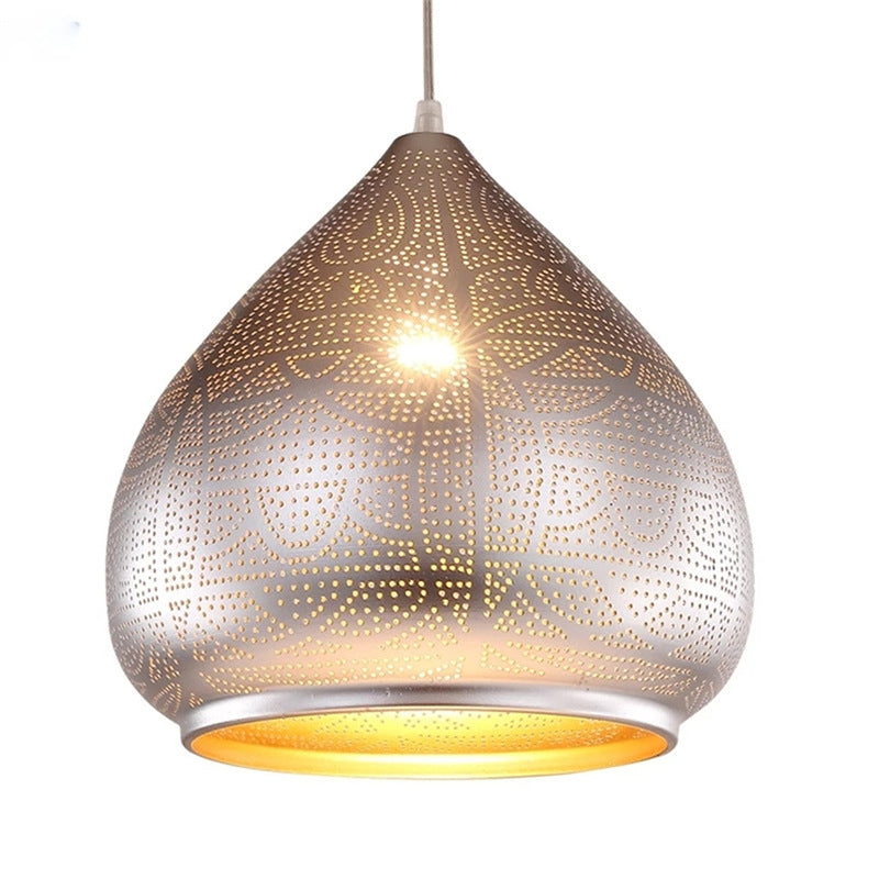 Close-up view of the industrial chic iron pendant light highlighting the hollow-carved shade.