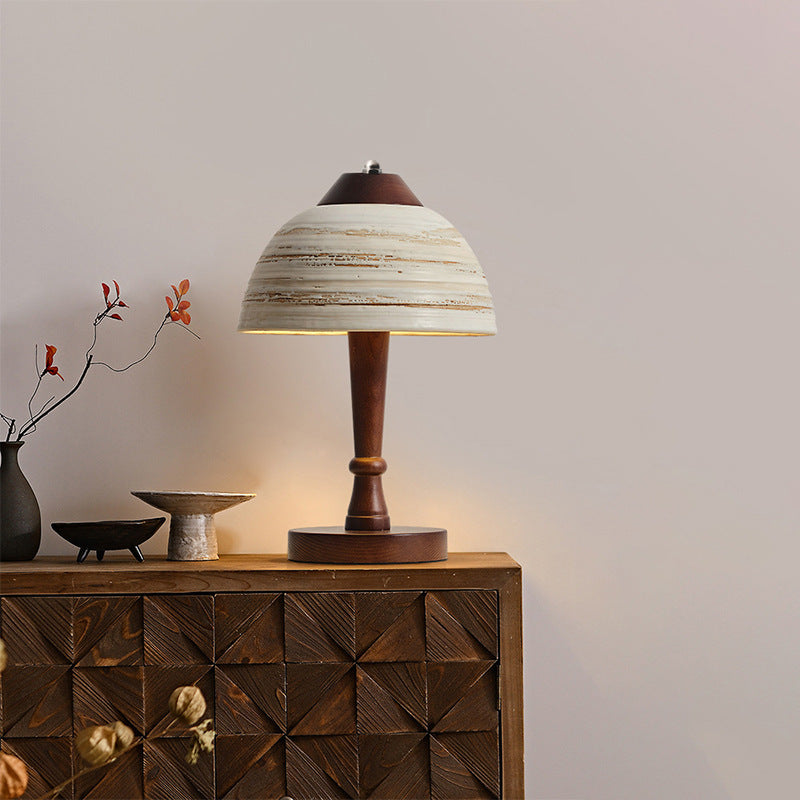 Stylish table lamp for reading, illuminating a modern workspace with soft light.