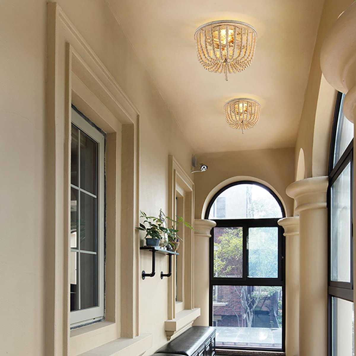 Close-up of beige wood beads and metal accents on the ceiling light.