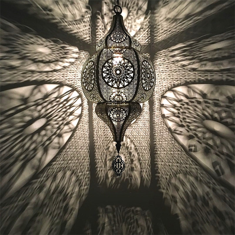 Moroccan vintage light fixture illuminating a cozy patio space.