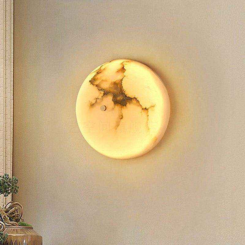 Elegant marble LED wall sconce showcasing the intricate marble pattern from the side
