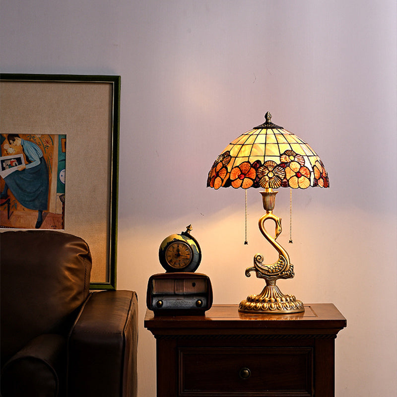 Elegant Swan Brass Table Lamp showcasing its unique design and copper base from a side angle.