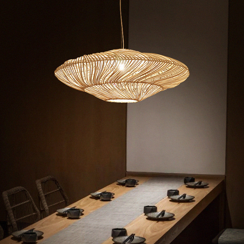 Elegant Chinese rattan pendant light showcasing its intricate weaving detail from a side angle.