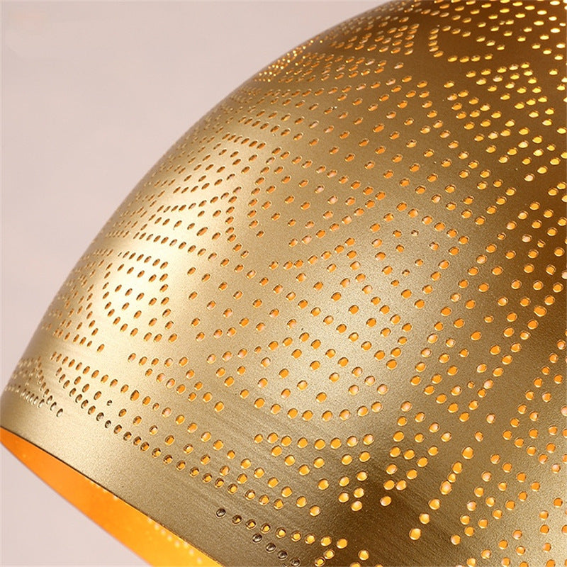 Close-up view of the industrial chic iron pendant light highlighting the hollow-carved shade.