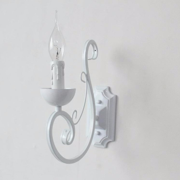 Close-up of the white metal shade of the LED candle wall lamp, showcasing its stylish design.