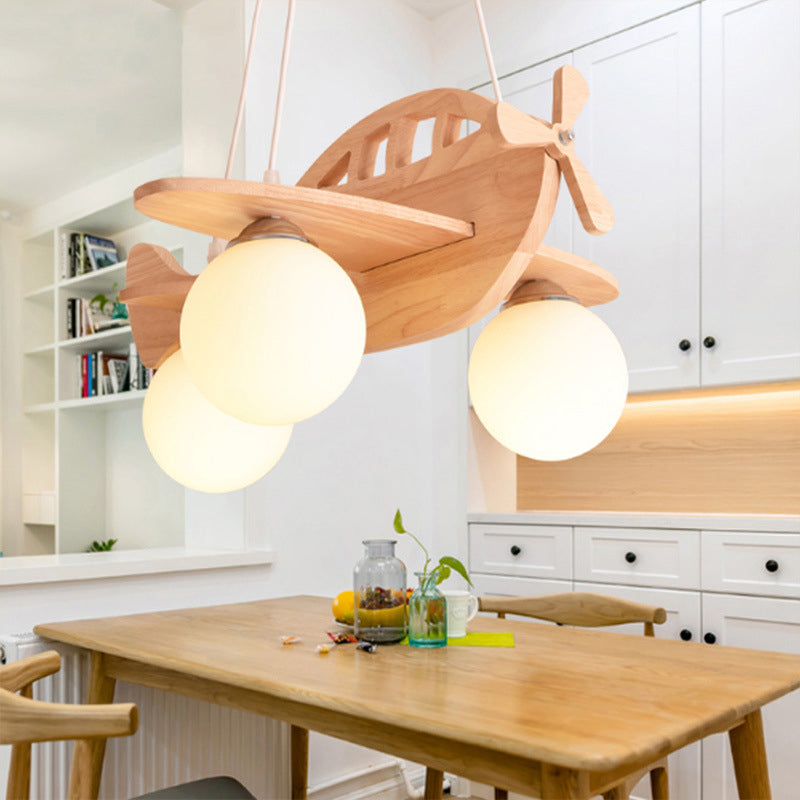 Airplane Adventure Wooden Pendant Light viewed from below, showcasing its unique design.