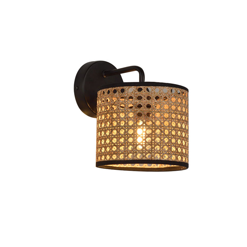 The rattan wall light installed in a cozy living room, creating a warm ambiance.
