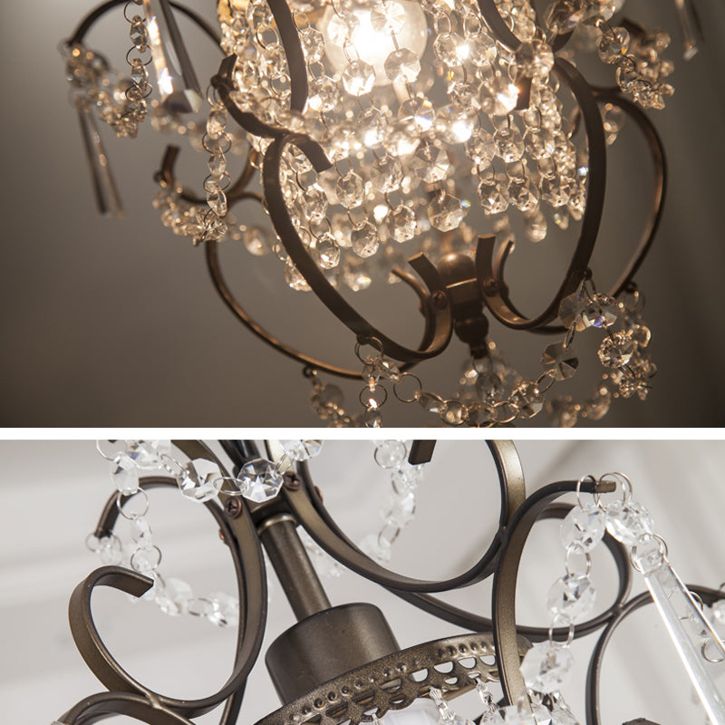 Elegant mini geometric crystal chandelier showcasing stunning light patterns in a cozy living room.