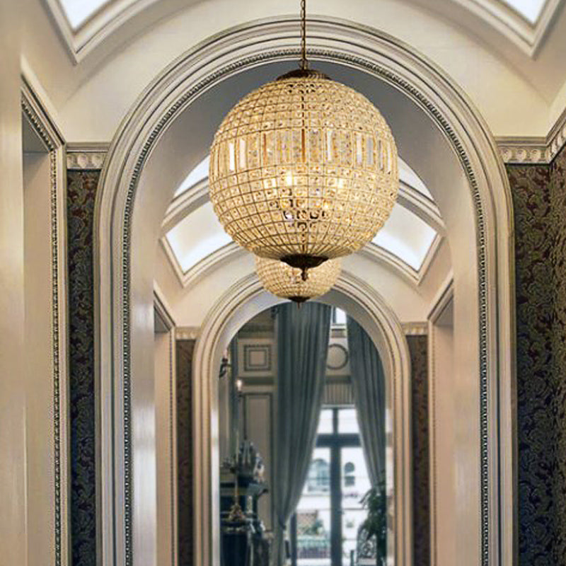 Unique crystal pendant light illuminating a chic kitchen island.