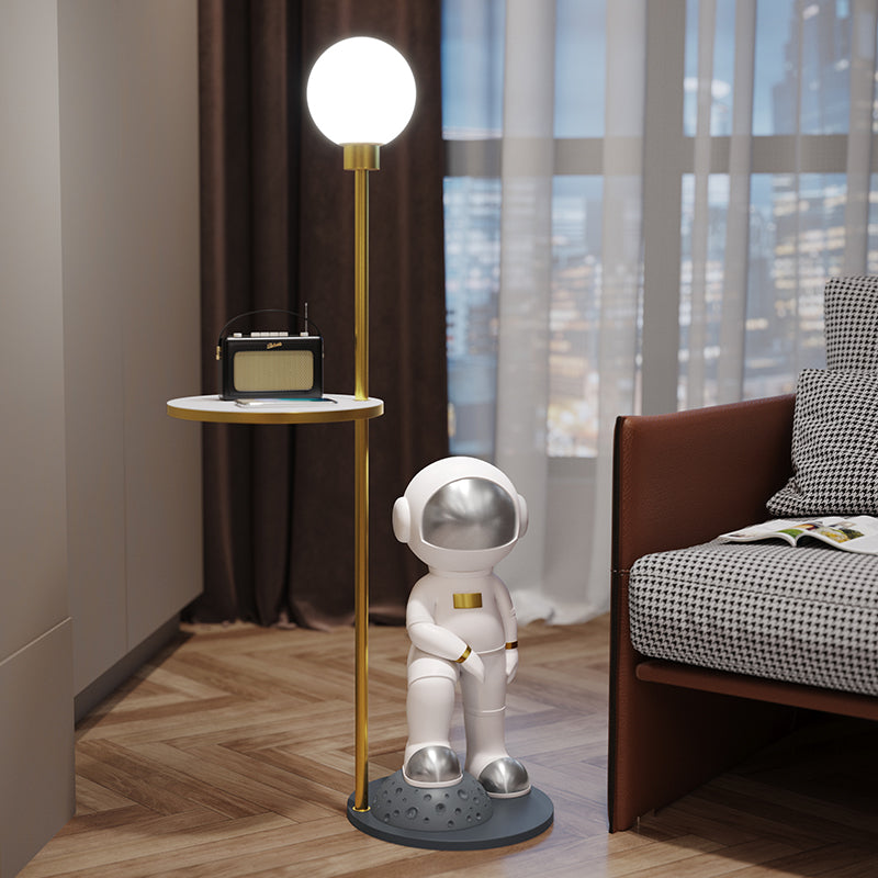 Close-up of the astronaut lamp showcasing its unique design and frosted glass shade.