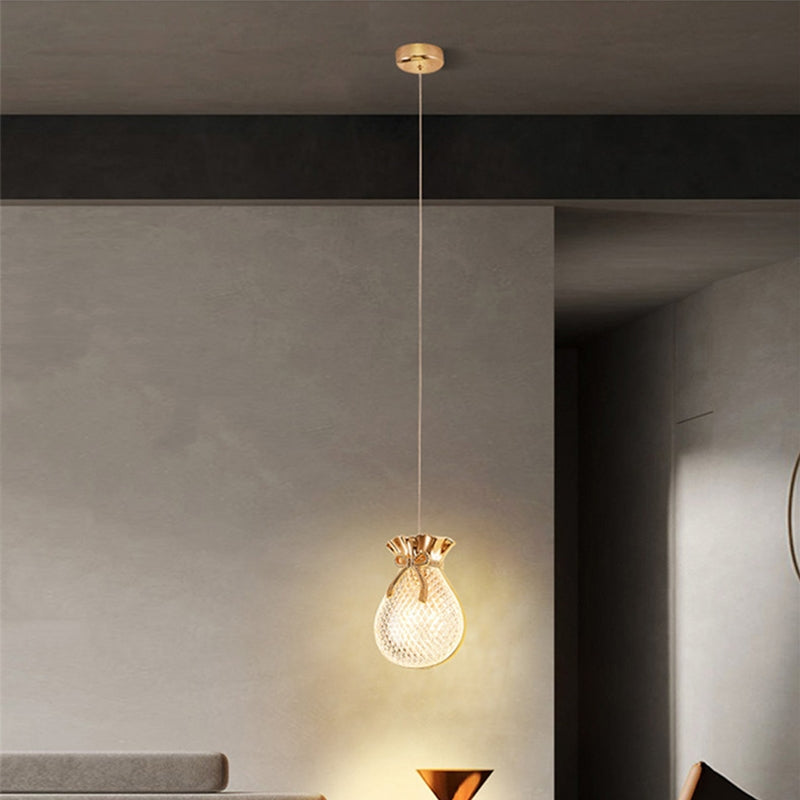 Close-up of the glass shade of the pendant light showcasing its unique design.
